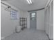 Functional storage room with patterned flooring, shelving, and a window for natural light, providing ample storage space at 6019 S Tacoma Ave, Indianapolis, IN 46227