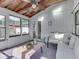 Bright sunroom with beamed ceilings and plenty of natural light at 6019 S Tacoma Ave, Indianapolis, IN 46227