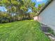 Spacious backyard featuring lush green lawn and additional building at 637 Olin Ave, Indianapolis, IN 46222