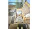A basement staircase with a wooden access door and a checkerboard tile floor at 637 Olin Ave, Indianapolis, IN 46222