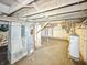Spacious unfinished basement featuring exposed wood beams, utilities, and a concrete floor at 637 Olin Ave, Indianapolis, IN 46222