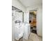 Bathroom with sink and urinal, walls are covered with graffiti; renovation potential at 637 Olin Ave, Indianapolis, IN 46222