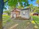 Charming exterior view of a home accented by vibrant green foliage at 637 Olin Ave, Indianapolis, IN 46222