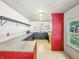 Renovation-ready kitchen with ample counter space, open shelving, and a large window at 637 Olin Ave, Indianapolis, IN 46222