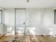 The room has white walls, and windows on each side of the white door at 637 Olin Ave, Indianapolis, IN 46222