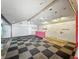 Spacious area with black and white checkerboard floor, ceiling fans, and graffiti style wall decor at 637 Olin Ave, Indianapolis, IN 46222
