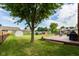 Spacious backyard with mature tree, deck, shed, and secure fencing for privacy and outdoor enjoyment at 662 Leah Way, Greenwood, IN 46142