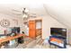 Finished attic bedroom with desk, sloped walls, and stair access at 662 Leah Way, Greenwood, IN 46142
