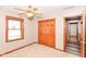 Bedroom features a window, carpeted floors and a double-door closet for storage at 662 Leah Way, Greenwood, IN 46142