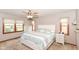 Bright bedroom with a ceiling fan and windows, creating a serene and comfortable atmosphere at 662 Leah Way, Greenwood, IN 46142