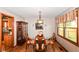 The dining area features a modern glass-topped table and wood chairs at 662 Leah Way, Greenwood, IN 46142