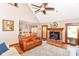 The living room is well-lit and features a sofa, oversized chair, fireplace and a view to the outside at 662 Leah Way, Greenwood, IN 46142
