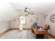 This home office features natural light, a ceiling fan, wood floors, and unique architectural details at 662 Leah Way, Greenwood, IN 46142