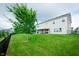 A backyard with a tree and a covered patio at 7147 Prelude Rd, Brownsburg, IN 46112