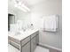 Clean bathroom with a double sink vanity, well-lit mirror, and fresh towels at 7147 Prelude Rd, Brownsburg, IN 46112