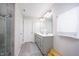 Well-lit bathroom featuring double vanity, decorative mirror, and modern fixtures at 7147 Prelude Rd, Brownsburg, IN 46112
