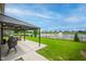 Relaxing covered patio with outdoor seating and a scenic lake backdrop at 7147 Prelude Rd, Brownsburg, IN 46112