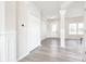 Inviting foyer with elegant trim, leading to various rooms at 7147 Prelude Rd, Brownsburg, IN 46112