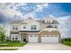 Beautiful two-story home with a stone facade and attached three-car garage, complete with manicured lawn at 7147 Prelude Rd, Brownsburg, IN 46112