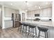 Modern kitchen featuring stainless steel appliances, an island with seating, and pendant lights at 7147 Prelude Rd, Brownsburg, IN 46112