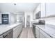 Modern kitchen with stainless steel appliances, granite countertops and a chalkboard at 7147 Prelude Rd, Brownsburg, IN 46112