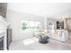 Bright living room with a large window, a modern couch, and decor at 7147 Prelude Rd, Brownsburg, IN 46112