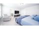Bright primary bedroom featuring a comfortable bed, sitting chair, and ample natural light at 7147 Prelude Rd, Brownsburg, IN 46112