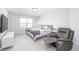 Comfortable primary bedroom featuring a comfy bed, chair, and natural light at 7147 Prelude Rd, Brownsburg, IN 46112