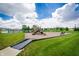 Community playground with various play structures and ample green space at 7147 Prelude Rd, Brownsburg, IN 46112