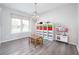 Bright playroom featuring a large window and stylish light fixture at 7147 Prelude Rd, Brownsburg, IN 46112