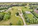 Lush green property featuring homes, outbuildings, and mature trees in a serene and expansive landscape at 7304 E Stop 11 Rd, Indianapolis, IN 46259