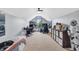 Large bonus room featuring a racing simulator, large windows, and a Stormtrooper statue at 7304 E Stop 11 Rd, Indianapolis, IN 46259