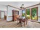 Charming dining room features ample natural light, wood floors, and traditional furnishings at 7304 E Stop 11 Rd, Indianapolis, IN 46259