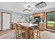 Bright kitchen with a center island, wood cabinets, and a view of the backyard at 7304 E Stop 11 Rd, Indianapolis, IN 46259