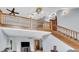 Great room with wooden staircase and railing at 7304 E Stop 11 Rd, Indianapolis, IN 46259