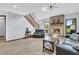 Inviting living room featuring a brick fireplace, wood floors, and a comfortable seating arrangement at 7304 E Stop 11 Rd, Indianapolis, IN 46259