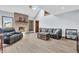 Spacious living room featuring a brick fireplace and ample natural light from the skylights at 7304 E Stop 11 Rd, Indianapolis, IN 46259