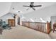 Loft area featuring plush seating, and a view of the natural light from the windows at 7304 E Stop 11 Rd, Indianapolis, IN 46259