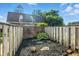 Small backyard with privacy fence and brick accent wall at 7468 Countrybrook Dr, Indianapolis, IN 46260