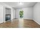 Bright bedroom featuring a window, wood floors, and built-in drawers at 7468 Countrybrook Dr, Indianapolis, IN 46260