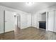 Bright bedroom with hardwood floors, neutral paint, and closet space at 7468 Countrybrook Dr, Indianapolis, IN 46260