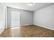 Bright bedroom with wood floors, a window, and a neutral color palette at 7468 Countrybrook Dr, Indianapolis, IN 46260