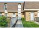 Charming brick townhome with well-manicured lawn and inviting entryway at 7468 Countrybrook Dr, Indianapolis, IN 46260