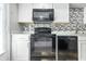 Updated kitchen showcases stainless steel appliances and stylish backsplash at 7468 Countrybrook Dr, Indianapolis, IN 46260
