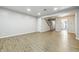 Large living room with wood flooring, stairs, and neutral paint, bathed in natural light at 7468 Countrybrook Dr, Indianapolis, IN 46260