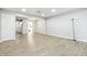 Open living room featuring wood flooring, recessed lighting, and access to the kitchen at 7468 Countrybrook Dr, Indianapolis, IN 46260