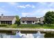 Tranquil backyard with a pond, lush greenery, and well-maintained lawn at 8213 Thoroughbred Run, Indianapolis, IN 46256