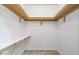 Walk-in closet with shelves and clothes bars at 8213 Thoroughbred Run, Indianapolis, IN 46256