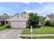 Well-maintained home with a two-car garage, charming curb appeal, and a neatly landscaped yard at 8213 Thoroughbred Run, Indianapolis, IN 46256