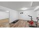 Basement workout area with wood floors, exercise equipment, and a window at 8336 Bent Oak Dr, Indianapolis, IN 46236